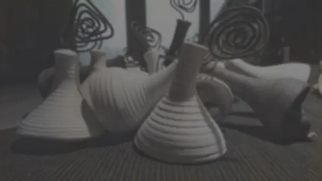 Cone-shaped pieces with wire spirals, black and white